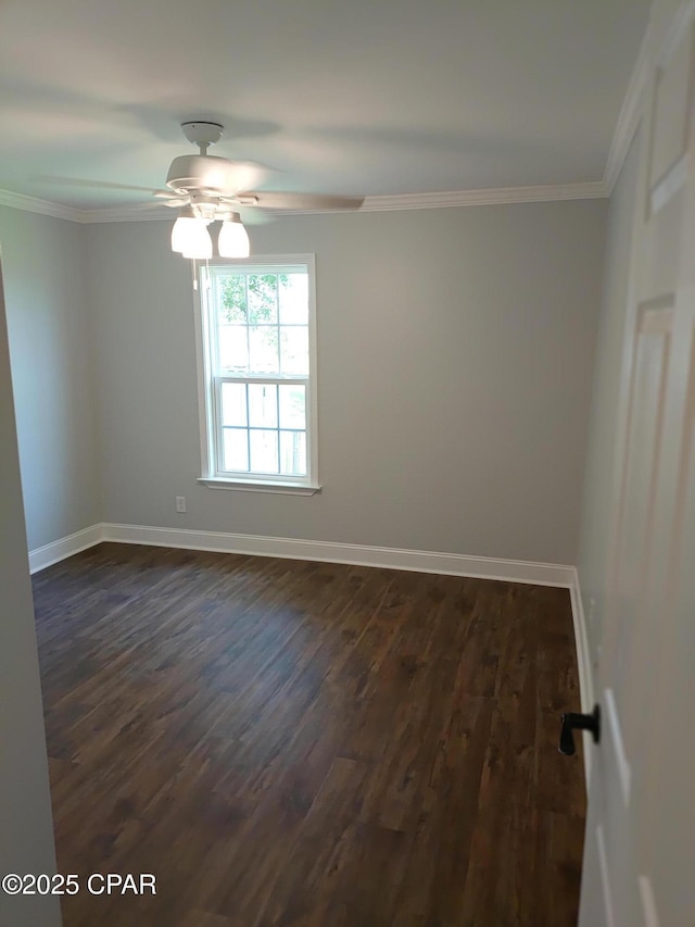 2525 E 40th Ct, Panama City, FL 32405 - spare room featuring crown molding, dark wood-style flooring, a ceiling fan, and baseboards