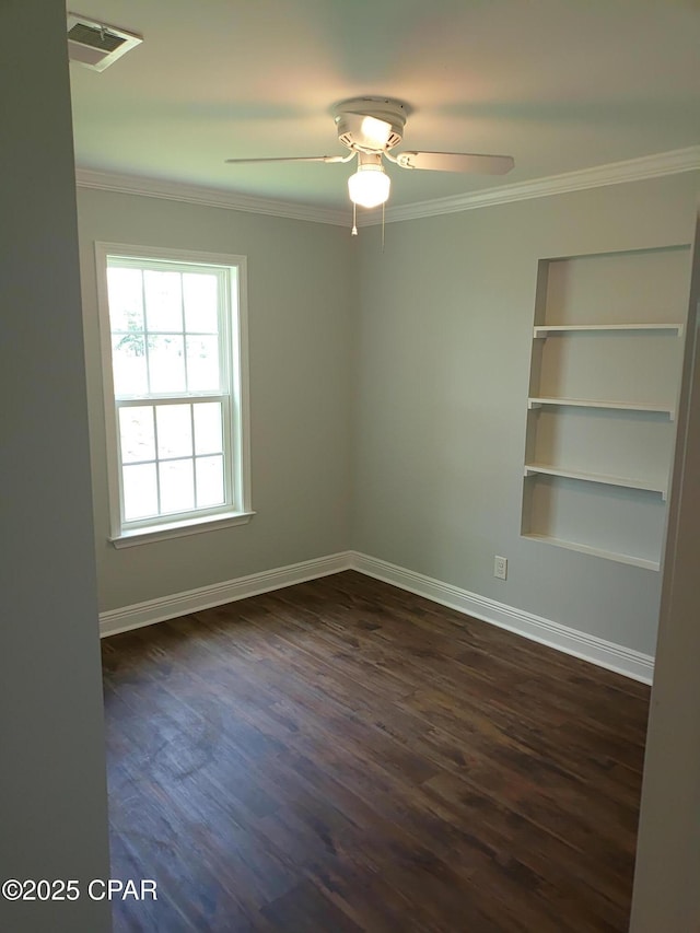 2525 E 40th Ct, Panama City, FL 32405 - spare room with ceiling fan, built in features, baseboards, visible vents, and ornamental molding