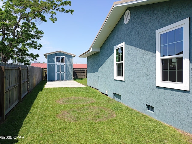 2525 E 40th Ct, Panama City, FL 32405 - view of yard with a storage shed, an outbuilding, and a fenced backyard