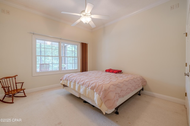 bedroom with crown molding, a ceiling fan, baseboards, and carpet floors