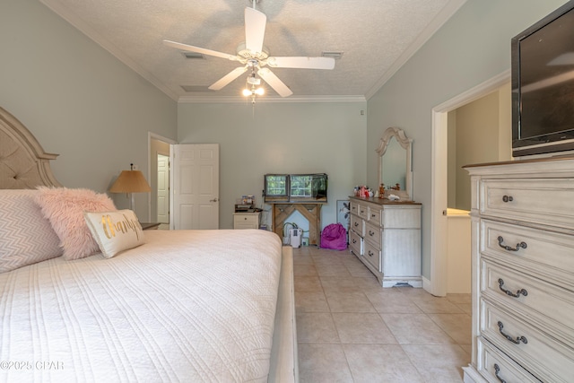 bedroom with ceiling fan, a textured ceiling, visible vents, crown molding, and light tile patterned floors