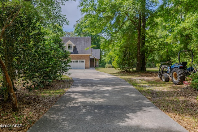 view of front facade featuring an attached garage and driveway
