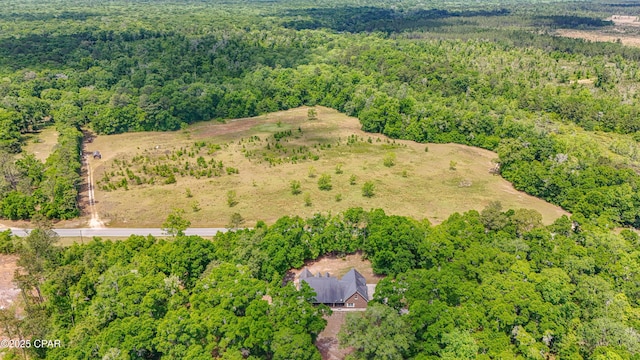 drone / aerial view with a view of trees