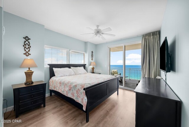 17739 Front Beach Rd Unit 1207W, Panama City Beach, FL 32413 - bedroom featuring baseboards, light wood-style flooring, ceiling fan, and access to exterior