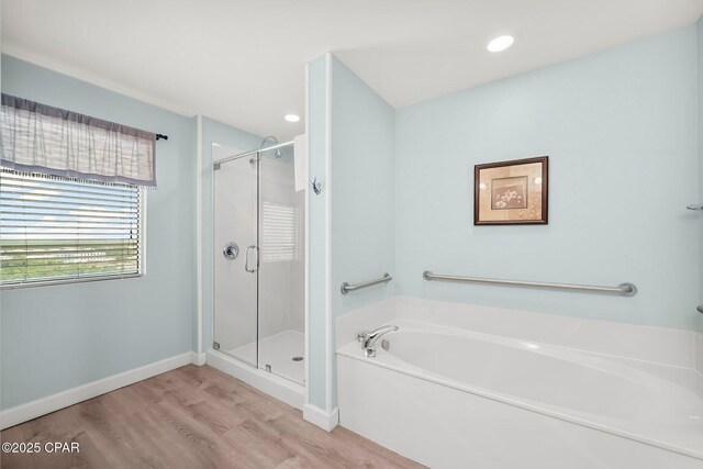 17739 Front Beach Rd Unit 1207W, Panama City Beach, FL 32413 - full bathroom featuring a shower stall, baseboards, a bath, and wood finished floors