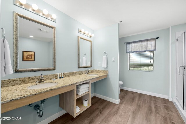 17739 Front Beach Rd Unit 1207W, Panama City Beach, FL 32413 - bathroom featuring a sink, a stall shower, and wood finished floors