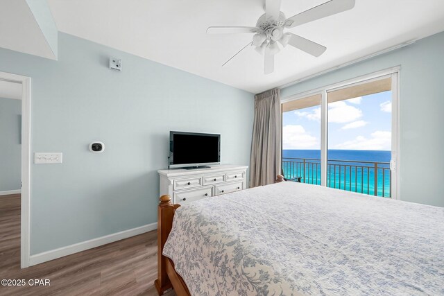 17739 Front Beach Rd Unit 1207W, Panama City Beach, FL 32413 - bedroom featuring a ceiling fan, baseboards, access to exterior, and wood finished floors