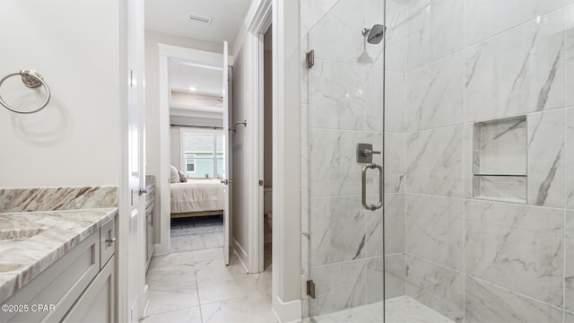 845 Walsonham Dr, Panama City Beach, FL 32407 - bathroom with marble finish floors, ensuite bath, a marble finish shower, and vanity