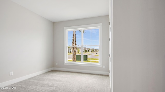 845 Walsonham Dr, Panama City Beach, FL 32407 - empty room featuring plenty of natural light, baseboards, and light colored carpet