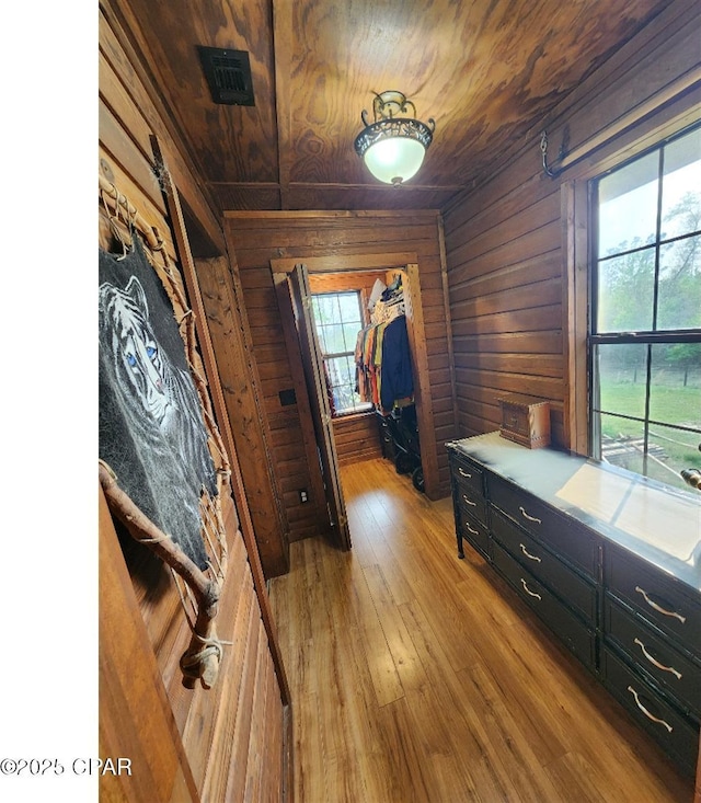 14235 NW Henry Grantham Rd, Altha, FL 32421 - interior space featuring wooden ceiling, wood walls, plenty of natural light, and visible vents