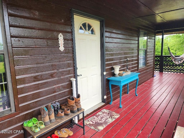 wooden terrace featuring a porch