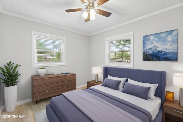 871 2nd St, Chipley, FL 32428 - bedroom with multiple windows, ornamental molding, baseboards, light wood-style floors, and ceiling fan