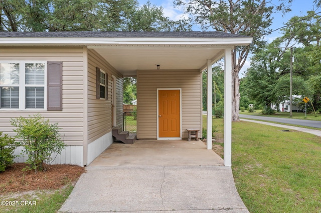 871 2nd St, Chipley, FL 32428 - view of parking / parking lot with an attached carport and concrete driveway