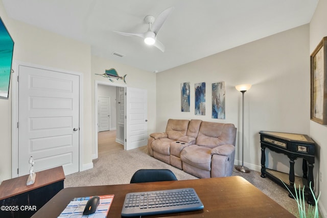 1294 Conolly Blvd, Lynn Haven, FL 32444 - carpeted living room featuring a ceiling fan, baseboards, and an office area