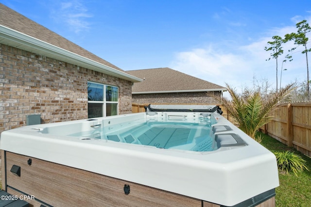 1294 Conolly Blvd, Lynn Haven, FL 32444 - view of swimming pool with a hot tub and fence