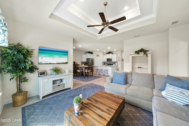 1294 Conolly Blvd, Lynn Haven, FL 32444 - living area with a raised ceiling, a ceiling fan, ornamental molding, wood finished floors, and recessed lighting
