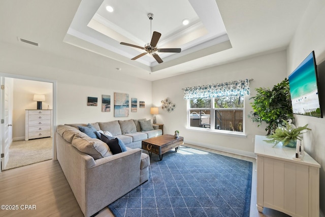 1294 Conolly Blvd, Lynn Haven, FL 32444 - living room featuring ceiling fan, wood finished floors, a raised ceiling, crown molding, and recessed lighting