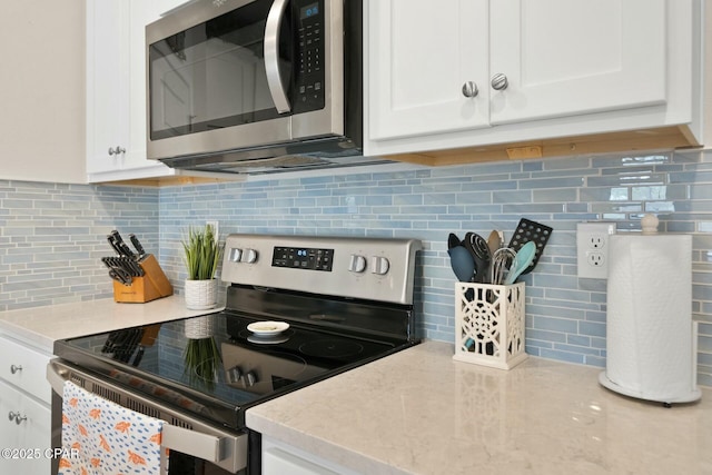 1294 Conolly Blvd, Lynn Haven, FL 32444 - kitchen featuring stainless steel appliances, backsplash, and white cabinets