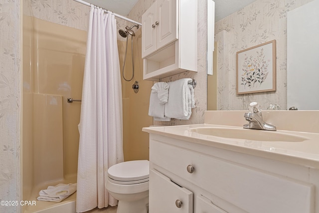 bathroom featuring toilet, a shower with shower curtain, vanity, and wallpapered walls