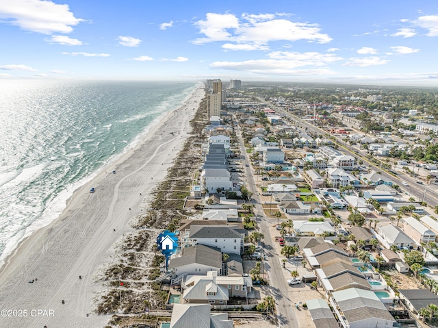 aerial view of residential area featuring expansive coastline