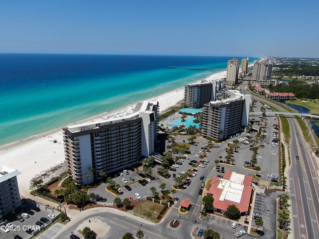 view of urban area featuring expansive beach
