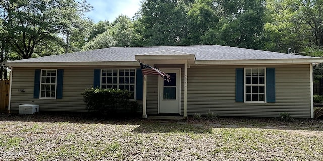 view of front of house with a shingled roof