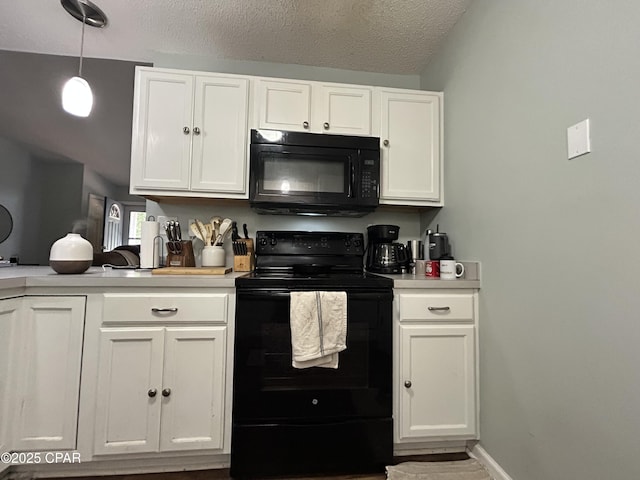 kitchen with light countertops, white cabinetry, and black appliances