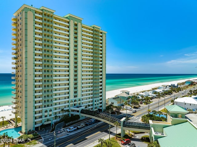 view of property featuring a water view and a view of the beach