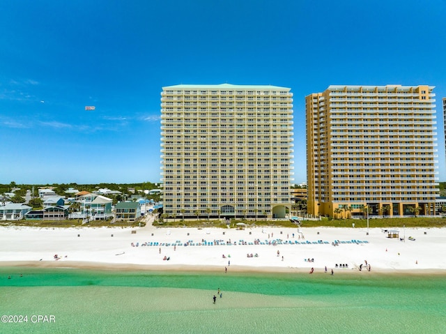 drone / aerial view featuring a view of the beach and a water view