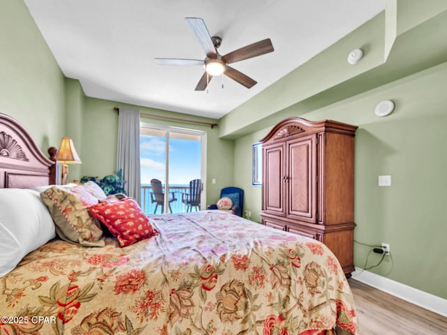bedroom with a ceiling fan, access to outside, light wood-style flooring, and baseboards