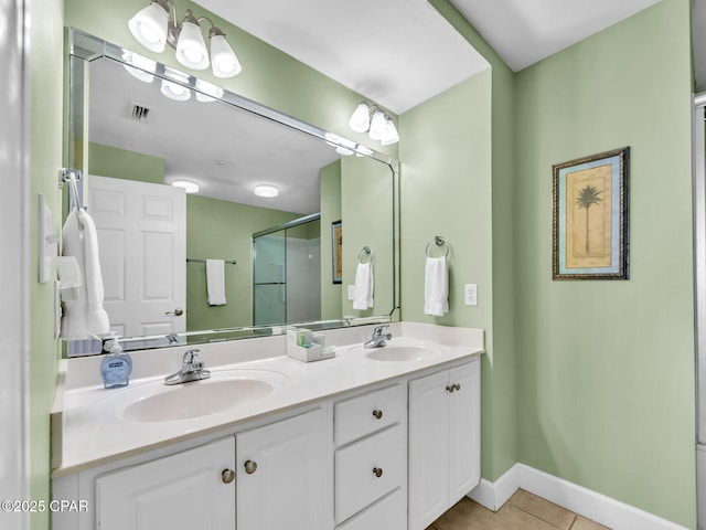 bathroom with a shower stall, tile patterned floors, visible vents, and a sink