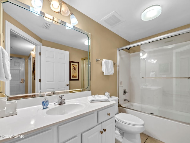 bathroom with toilet, visible vents, bath / shower combo with glass door, and vanity