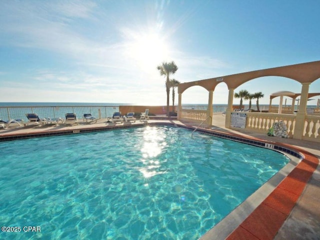 community pool featuring a water view