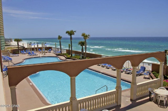 community pool featuring a water view