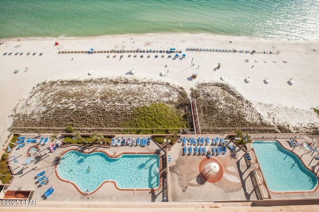 bird's eye view featuring a beach view and a water view