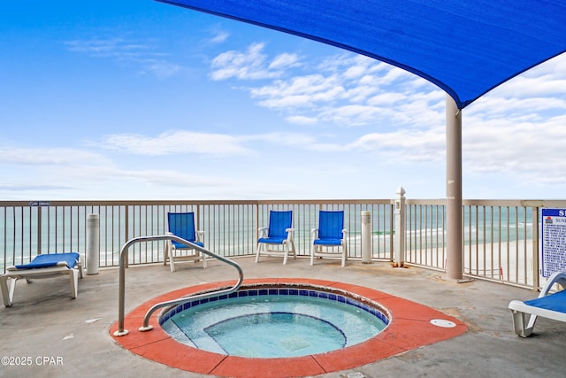 view of pool featuring a patio and a hot tub
