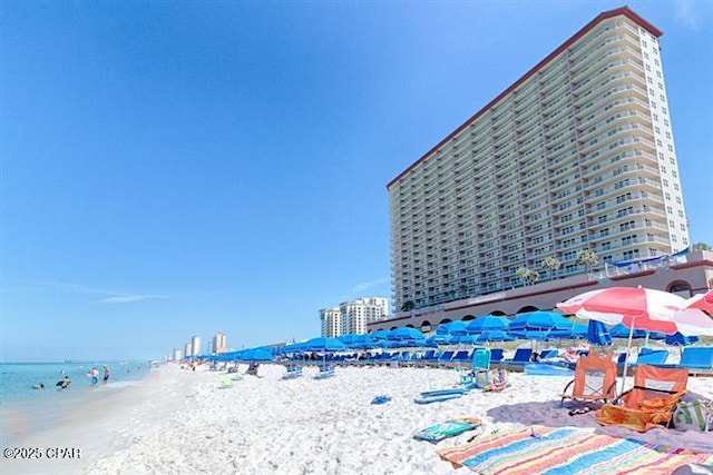 property view of water featuring a beach view