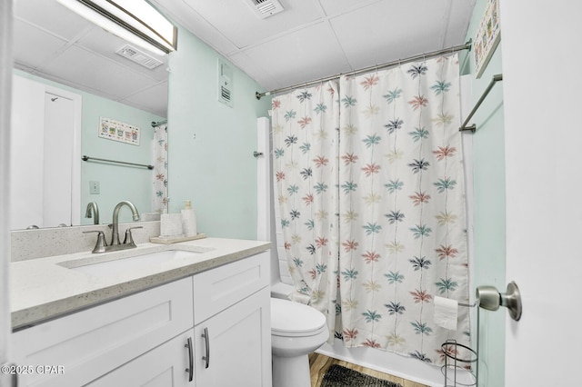 full bathroom with toilet, vanity, and shower / bath combination with curtain