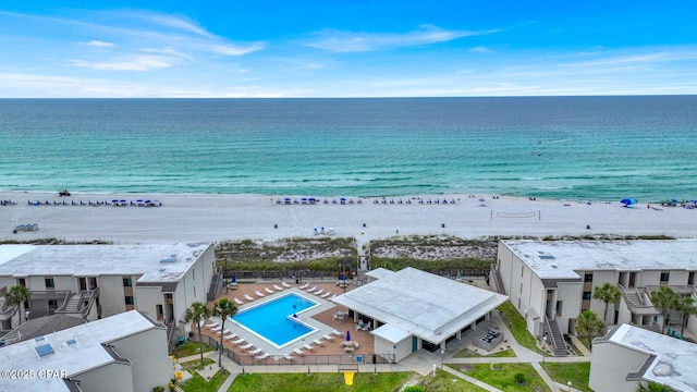 aerial view of expansive beach and a pool area