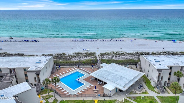 drone / aerial view of expansive beach and a pool