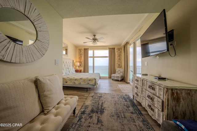 bedroom featuring ceiling fan and wood finished floors
