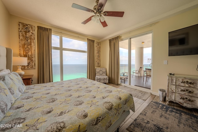bedroom featuring wood finished floors and a ceiling fan