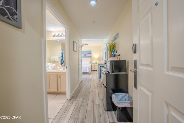 hallway with wood finish floors