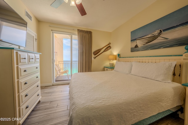 bedroom with baseboards, ceiling fan, visible vents, access to outside, and light wood-type flooring