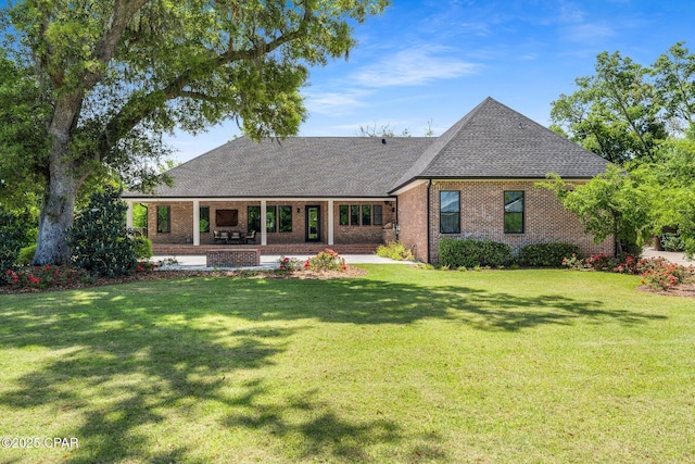 9714 Summer Creek Dr, Panama City, FL 32409 - back of house featuring a shingled roof, brick siding, a yard, and a patio