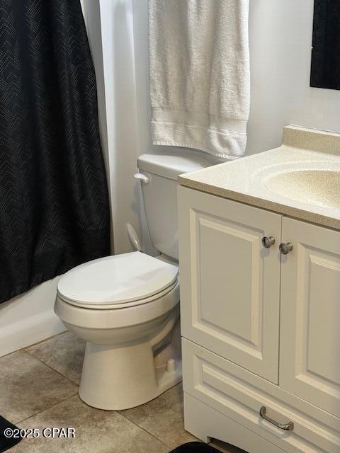 25 Wood Ave, Panama City, FL 32404 - full bath with vanity, toilet, a shower with curtain, and tile patterned floors