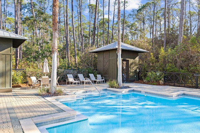 345 Redbud Ln, Inlet Beach, FL 32461 - view of swimming pool with a shed, a patio, and view of scattered trees