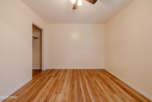 215 Tates Ln, Southport, FL 32409 - unfurnished bedroom with baseboards, light wood-type flooring, a ceiling fan, and a closet