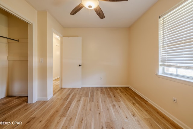 215 Tates Ln, Southport, FL 32409 - unfurnished bedroom with baseboards, light wood finished floors, a closet, and a ceiling fan
