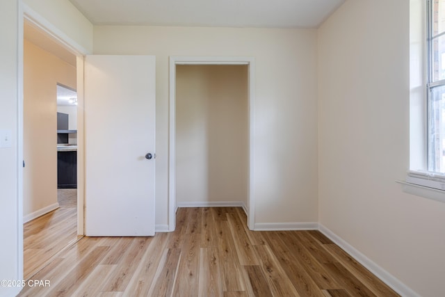 215 Tates Ln, Southport, FL 32409 - unfurnished bedroom featuring baseboards and light wood-type flooring